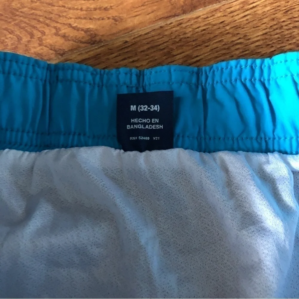 George blue and teal swim trunks in size M (32-34)